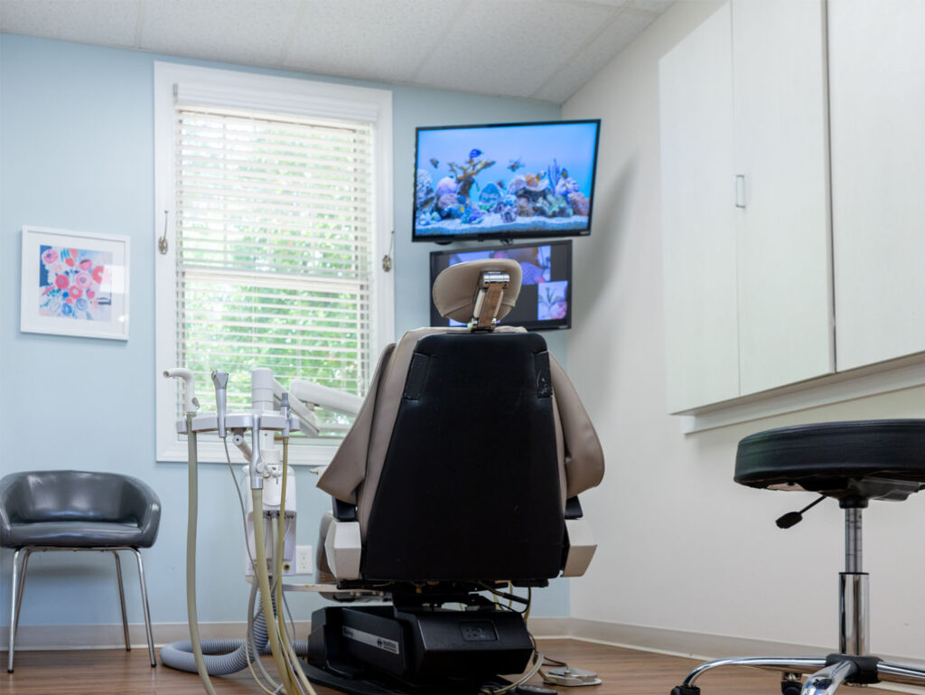 patient room with a dental chair and tv